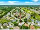 Community aerial view with tennis courts and mature trees at 8961 Se 130Th Loop, Summerfield, FL 34491