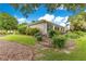 The exterior of the home shows well-maintained landscaping and mature trees at 8961 Se 130Th Loop, Summerfield, FL 34491