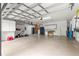 Spacious three car garage for storage with an automatic door at 8961 Se 130Th Loop, Summerfield, FL 34491
