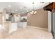Kitchen area showcasing granite counters, white cabinets and neutral colors at 8961 Se 130Th Loop, Summerfield, FL 34491
