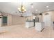 Spacious kitchen with granite countertops, stainless steel appliances, and a center island at 8961 Se 130Th Loop, Summerfield, FL 34491