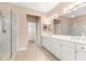 Main bathroom featuring double vanity, glass shower, and tile flooring at 8961 Se 130Th Loop, Summerfield, FL 34491