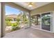 Spacious screened-in patio with a view of the landscaped yard at 8961 Se 130Th Loop, Summerfield, FL 34491