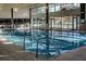 An indoor lap pool with natural light and easy access for swimmers at 8961 Se 130Th Loop, Summerfield, FL 34491