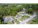 Aerial view of a residential neighborhood featuring well-maintained homes and tree coverage at 9 Bahia Trace Loop, Ocala, FL 34472