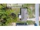 Aerial view of a home with a well-kept backyard and surrounded by mature trees at 9 Bahia Trace Loop, Ocala, FL 34472