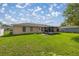 Spacious backyard featuring a screened in porch at 9 Bahia Trace Loop, Ocala, FL 34472