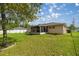 Expansive backyard with a screened-in porch, perfect for outdoor enjoyment at 9 Bahia Trace Loop, Ocala, FL 34472
