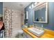 Bathroom features a shower and tub combination with a single sink vanity and updated fixtures at 9 Bahia Trace Loop, Ocala, FL 34472