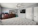 Cozy bedroom featuring gray walls and wood furniture at 9 Bahia Trace Loop, Ocala, FL 34472