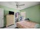 Bright bedroom with green walls and closet at 9 Bahia Trace Loop, Ocala, FL 34472
