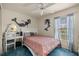 A cute bedroom features blue carpet and mermaid decals at 9 Bahia Trace Loop, Ocala, FL 34472