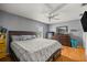 Well-lit bedroom with wooden floors and neutral decor at 9 Bahia Trace Loop, Ocala, FL 34472