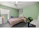 Bright bedroom with green walls and a ceiling fan at 9 Bahia Trace Loop, Ocala, FL 34472