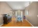 Dining room with natural light, wood-look floors, neutral paint, and views to the backyard at 9 Bahia Trace Loop, Ocala, FL 34472
