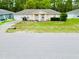Charming single story home with a well-manicured lawn and inviting front porch and driveway at 9 Bahia Trace Loop, Ocala, FL 34472