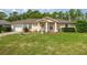 Charming single-story home featuring a well-manicured lawn and inviting front entrance at 9 Bahia Trace Loop, Ocala, FL 34472