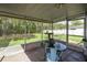 Cozy screened porch overlooking a lush backyard at 9 Bahia Trace Loop, Ocala, FL 34472