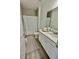 Well-lit bathroom featuring a single vanity, neutral color scheme, and shower with curtain for practical comfort at 9253 Sw 58Th Cir, Ocala, FL 34476
