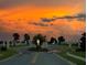 A beautiful evening view of neighborhood entrance as the sun sets at 9253 Sw 58Th Cir, Ocala, FL 34476