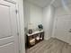 Inviting entryway featuring a stylish console table, modern decor, and sleek tile flooring at 9253 Sw 58Th Cir, Ocala, FL 34476