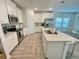 Modern kitchen with stainless steel appliances, a large island, and beautiful countertops at 9253 Sw 58Th Cir, Ocala, FL 34476
