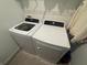 Convenient laundry room equipped with modern washer and dryer units at 9253 Sw 58Th Cir, Ocala, FL 34476