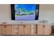 Spacious living room featuring custom cabinets with ample storage beneath a wall-mounted television at 9253 Sw 58Th Cir, Ocala, FL 34476