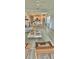 Bright and open living space connects seamlessly with the kitchen, dining area, and cozy furnishings at 9253 Sw 58Th Cir, Ocala, FL 34476
