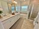Bright and spacious main bathroom with double sinks, garden tub and glass shower at 9253 Sw 58Th Cir, Ocala, FL 34476