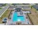 Aerial view of community pool featuring ample lounge chairs and a covered picnic area at 9253 Sw 58Th Cir, Ocala, FL 34476