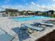 Relaxing community pool area featuring lounge chairs and a shaded pergola at 9253 Sw 58Th Cir, Ocala, FL 34476