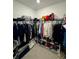 Spacious walk-in closet with ample shelving, hanging racks, and organized storage solutions, providing a tidy space at 9253 Sw 58Th Cir, Ocala, FL 34476