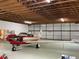 Private airplane inside a hangar with high ceilings and ample space at 9622 Se 71St Ct, Ocala, FL 34472
