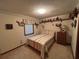 Comfortable bedroom with a twin bed, shelves with decorations, and one window at 9622 Se 71St Ct, Ocala, FL 34472