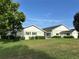 Spacious house with well maintained lawn, landscaping and exterior shutters at 9622 Se 71St Ct, Ocala, FL 34472