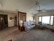 Comfortable living area with natural light and carpeted floor at 9622 Se 71St Ct, Ocala, FL 34472