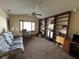 Cozy living room with an entire wall of custom shelving at 9622 Se 71St Ct, Ocala, FL 34472