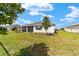 Beautiful backyard featuring a screened-in patio and large grassy area at 9865 Sw 105Th Ct, Ocala, FL 34481