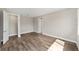 Spacious bedroom with modern wood-look flooring and white trim at 9865 Sw 105Th Ct, Ocala, FL 34481