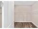 Walk-in closet featuring wood-look flooring and white wire shelving at 9865 Sw 105Th Ct, Ocala, FL 34481