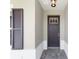 Close-up of a front door with a large window, sidelight and shuttered window at 9865 Sw 105Th Ct, Ocala, FL 34481