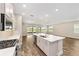 Modern kitchen features stainless appliances, large island, and an open floor plan with lots of natural light at 9865 Sw 105Th Ct, Ocala, FL 34481