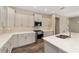 Modern kitchen boasts a spacious island, stainless steel appliances, and recessed lighting at 9865 Sw 105Th Ct, Ocala, FL 34481