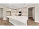 Gourmet kitchen features a large island, modern appliances, and elegant gray cabinets at 9865 Sw 105Th Ct, Ocala, FL 34481
