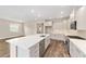 Modern kitchen boasts a large island, stainless appliances, and recessed lights at 9865 Sw 105Th Ct, Ocala, FL 34481