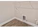 This laundry room features hookups for a washer and dryer, along with wire shelving at 9865 Sw 105Th Ct, Ocala, FL 34481