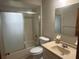 Bathroom with a combination shower and tub with sliding doors and a vanity at 11248 Sw 76Th Ter, Ocala, FL 34476