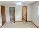 Another angle of the bedroom showing a ceiling fan and entry to the bathroom and closet at 11248 Sw 76Th Ter, Ocala, FL 34476
