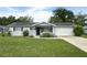 Charming single-story home with well-maintained lawn and attached one car garage at 11248 Sw 76Th Ter, Ocala, FL 34476